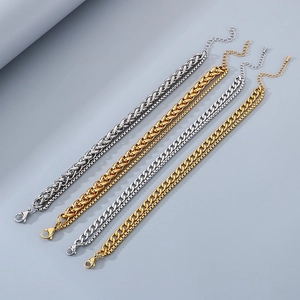 Detail of four gold and silver Cuban chain anklets with secure lobster clasps and extenders