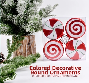 Detail of four red and white painted round Christmas ornaments in clear packaging
