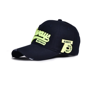 Close-up of vintage navy baseball cap with distressed brim and 3D letter embroidery