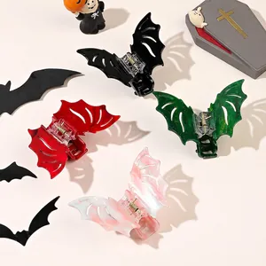 Set of bat-shaped hair claws in black, red, and marble finish for Halloween styling