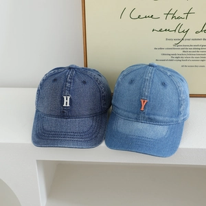 Kids denim baseball caps in dark and light blue with minimalist letter embroidery