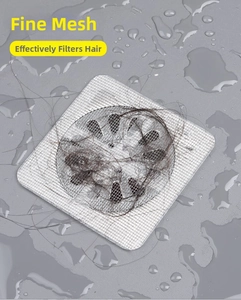 Detail of disposable mesh drain sticker effectively trapping hair on bathroom floors