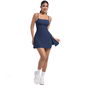 Detail of navy blue athletic dress featuring slim straps and a side slit for tennis