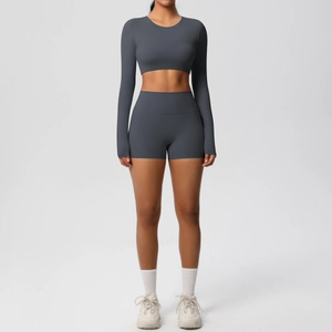 Front view of charcoal grey fitness set featuring long sleeve crop top and matching shorts