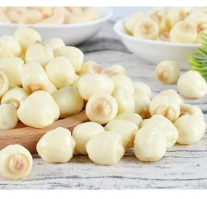 Macro shot of realistic PVC lotus seed models with natural cream-white texture and detail