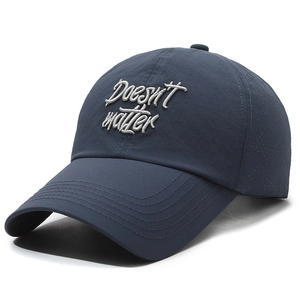 Lightweight navy blue baseball cap with laser-cut holes and white embroidery
