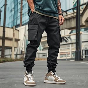 Detail shot of multi-pocket cargo pants showing durable fabric and street style utility design