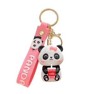Cute panda keychain with pink silicone strap and cola accessory on white background