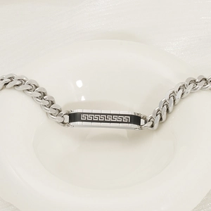 Men's silver Cuban link bracelet with black Greek meander pattern engraving on center plate