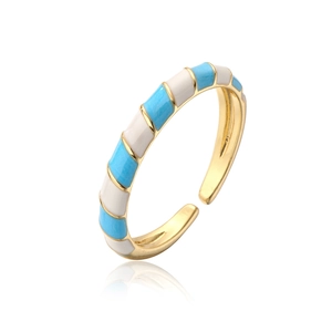 Detailed view of bohemian gold plated ring with blue and white enamel stripes