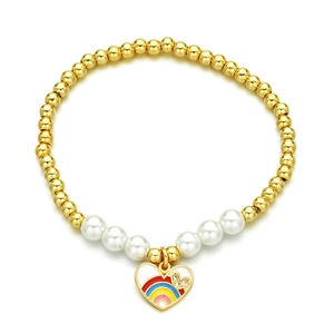 Golden beaded bracelet with white pearls and a colorful rainbow heart pendant