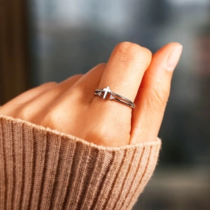 Elegant S925 sterling silver cross ring with cubic zirconia on double band worn by model
