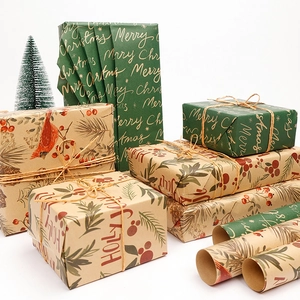 Brown kraft Christmas wrapping paper rolls with vintage bird and holly berry patterns