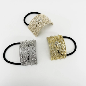 Three elegant geometric metal hair ties with hollow floral patterns, pearls, and rhinestones