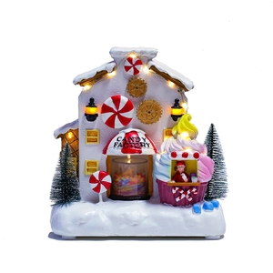 Luminous Christmas candy factory house with LED lights and festive tabletop decorations