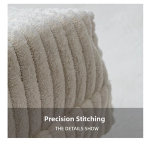 Detailed macro view of the cream corduroy fabric texture and fine stitching on the bag