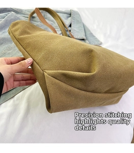 Close-up of precision stitching and durable canvas texture on large tote bag