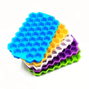 Set of 5 colorful honeycomb silicone ice cube trays in blue, yellow, white, purple, and green