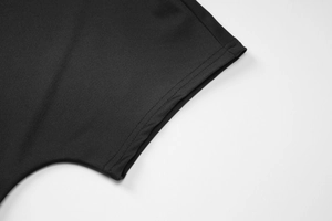 Close-up of double-stitched cuff on black slim fit T-shirt with breathable fabric texture