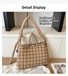 Detail of khaki quilted tote bag showing plush texture and adjustable knotted strap