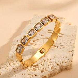 Titanium steel gold-plated bangle with rectangular crystals and a folding clasp