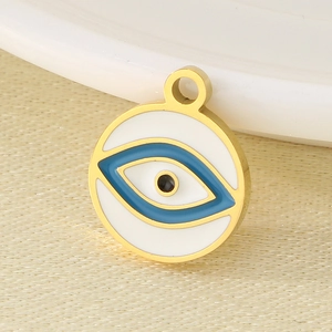 Macro shot of 18K gold-plated stainless steel evil eye pendant with white enamel finish