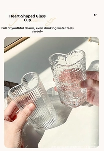 Detail of ribbed and hammered heart-shaped glass cups with elegant light refraction