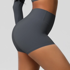 Detail view of high-waist charcoal yoga shorts showing seamless texture and shaping fit