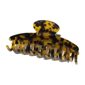 Close-up of tortoise shell hair claw clip with glossy finish and strong metal spring