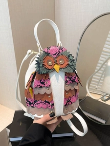Ethnic owl backpack with colorful patchwork embroidery and white textured faux leather