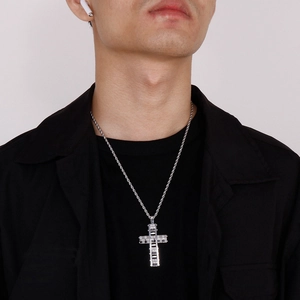 Close-up of a silver multi-layered stainless steel cross pendant with a twisted rope chain