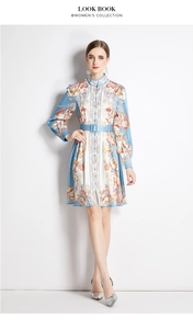 Close-up of vintage floral print dress featuring a stand collar and elegant button front