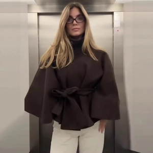 Brown wool cape coat with stand collar and waist belt in minimalist loose fit