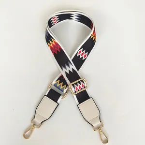 Detail of colorful wave pattern strap with white leather and gold metal hooks