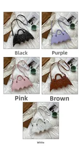 Detail view of gothic bat-shaped PU leather handbags in black, purple, pink, brown and white