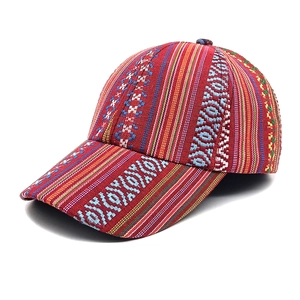 Detail of bohemian baseball cap with colorful ethnic patterns and jacquard texture
