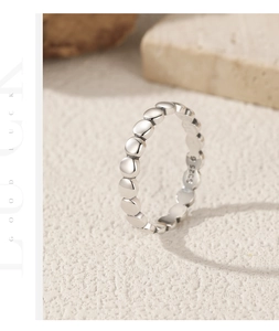 Macro shot of S925 sterling silver beaded ring detail with polished metal finish