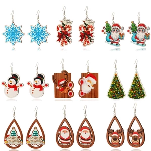 Christmas earrings set featuring snowflake, Santa Claus and reindeer designs on white background