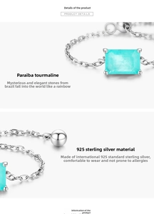 Macro detail of S925 sterling silver chain ring with rectangular Paraiba tourmaline