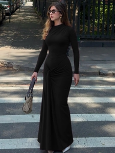 Elegant slim-fit black long sleeve maxi dress with stylish waist tie and knot detail