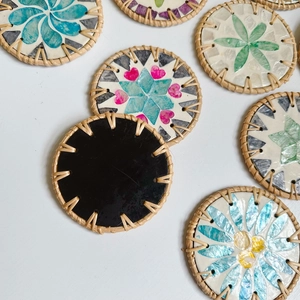 Handwoven rattan coasters with mosaic seashell patterns for heat insulation and decor