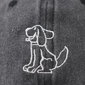 Washed cotton baseball cap with vintage finish featuring white dog embroidery