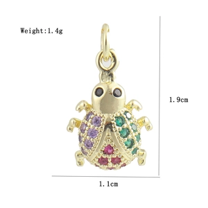 Detailed macro view of a ladybug pendant with colorful zircons and precise measurements