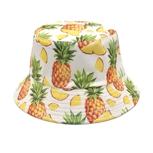 Close-up of white bucket hat with pineapple print and reinforced brim stitching details