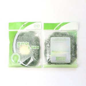 Floral acrylic hand-knitted dish scrubber in individual clear plastic packaging