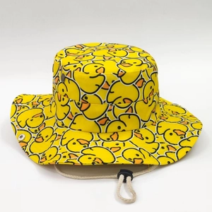 Yellow bucket hat with cartoon duck print featuring adjustable chin strap for outdoor sun protection