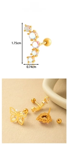 Detailed view of gold stainless steel heart and butterfly ear studs with opal stones