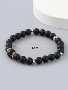 Men's matte black beaded bracelet featuring silver spacers and sparkling rhinestones