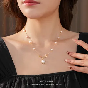 Vintage gold deer antler necklace with elegant pearls and sparkling zircon accents