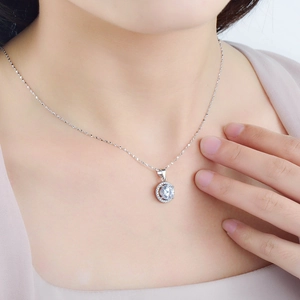 Elegant S925 sterling silver halo necklace with round cut cubic zirconia on a model